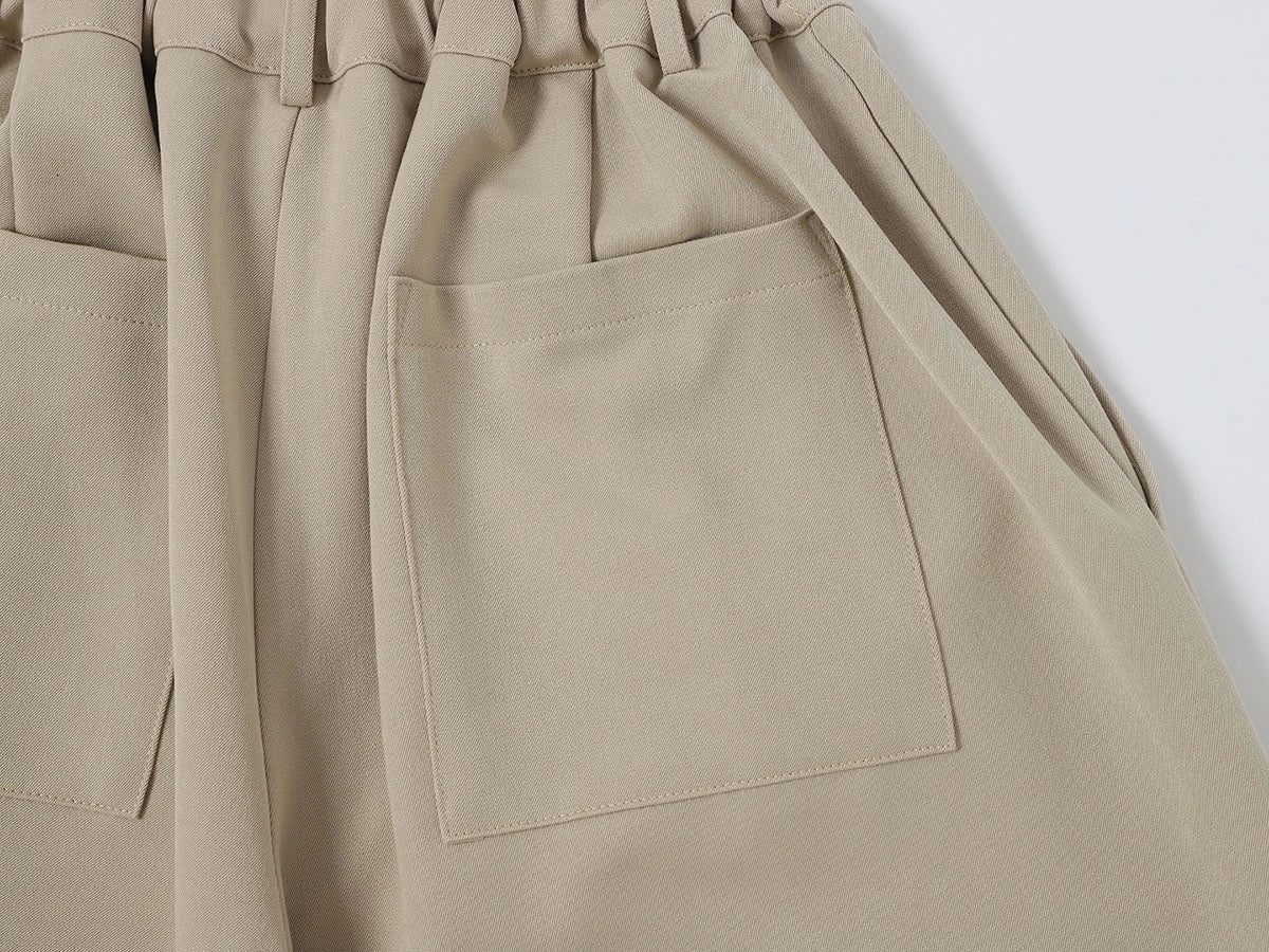 LOOSE FIT PLEATED 'SAND' SHORTS