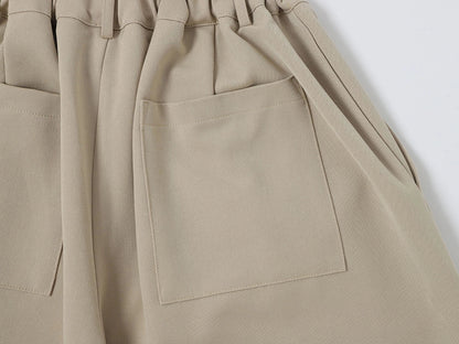 LOOSE FIT PLEATED 'SAND' SHORTS